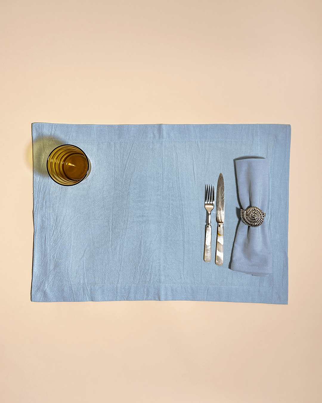 This cotton placemat comes in a set of 4 and ideally covers your dinner table. The whole tableware collection by Arles Studio is inspired by the idea of setting a fine table and sharing a meal with friends and family. The products are dyed by hand, keeping its natural texture and feel. The fabrics are made from 100% cotton and the soft and creamy pastel colors are spot on.  Our tip: mix and match with the Arles Studio napkins and tablecloths.