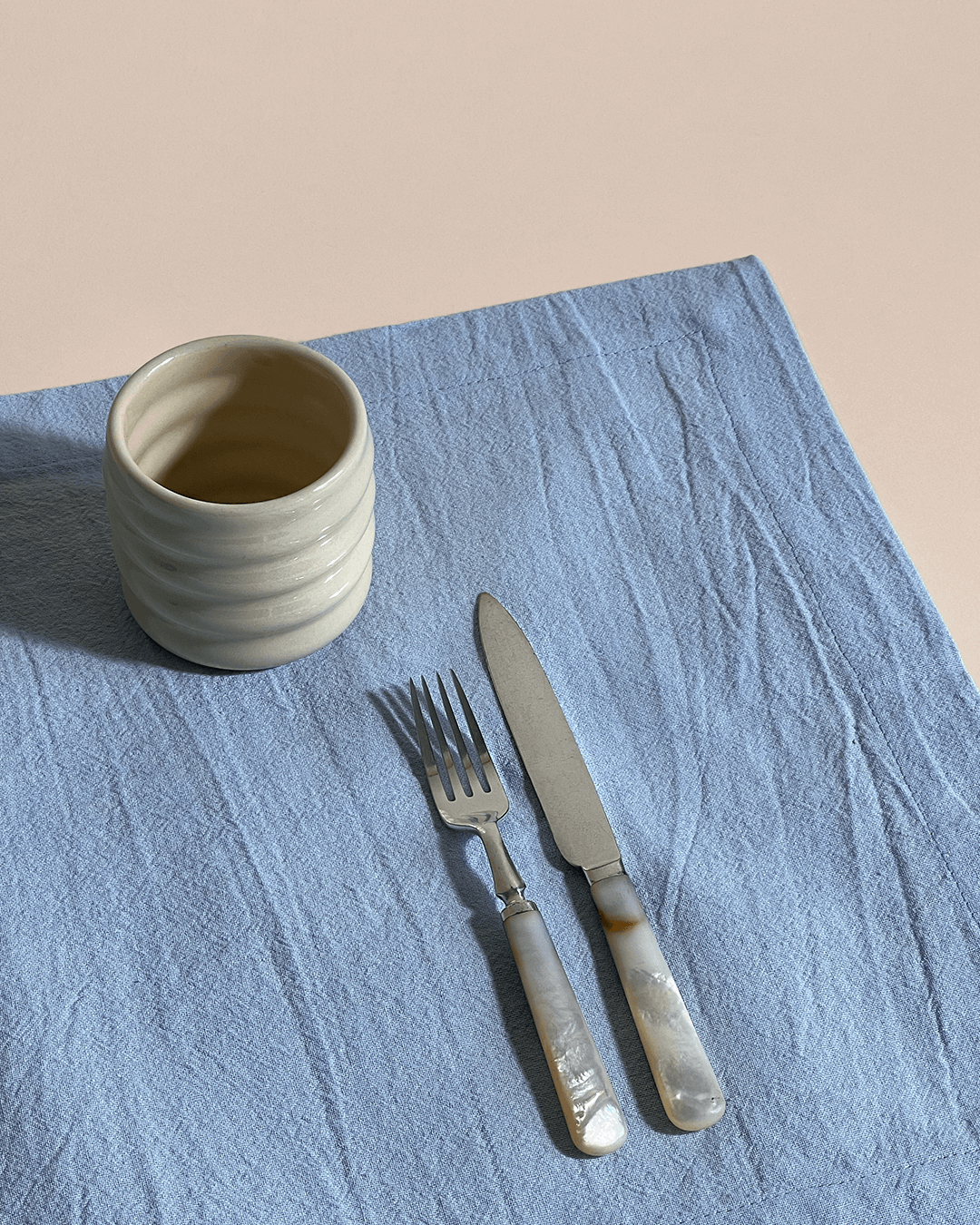 This cotton placemat comes in a set of 4 and ideally covers your dinner table. The whole tableware collection by Arles Studio is inspired by the idea of setting a fine table and sharing a meal with friends and family. The products are dyed by hand, keeping its natural texture and feel. The fabrics are made from 100% cotton and the soft and creamy pastel colors are spot on.  Our tip: mix and match with the Arles Studio napkins and tablecloths.