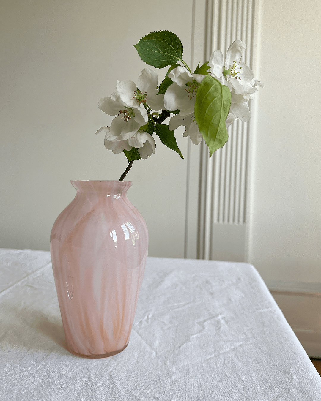 Very cute and delicate glass vase with a marbly rose coloration. 