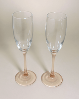 Champagne flutes with a pink stem to cheer with on your next celebration. The glasses come in a set of 2.
