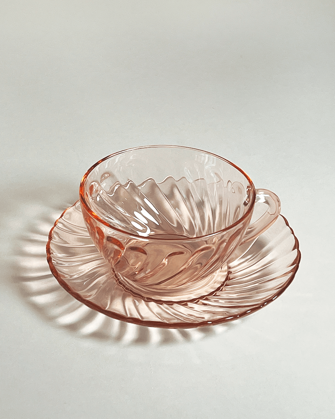 Cup and saucer set from the 1960ies by Arcoroc in a beautiful blushed pink. 